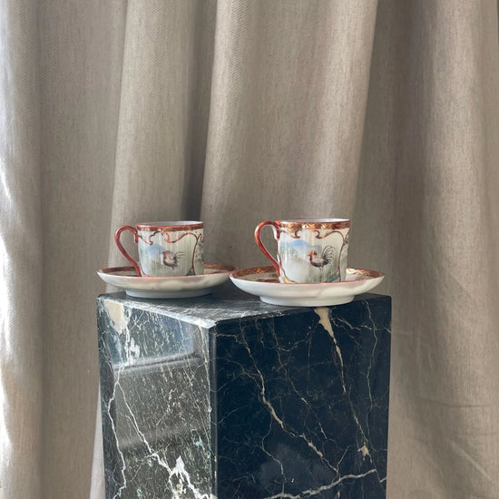 A Pair of Red Japanese Espresso Cups and Saucers