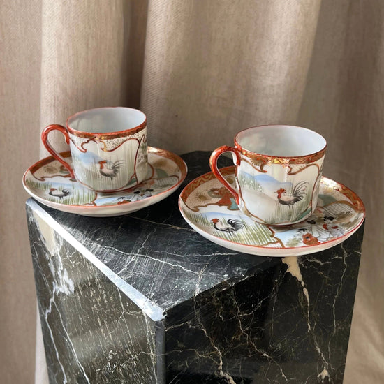 A Pair of Red Japanese Espresso Cups and Saucers