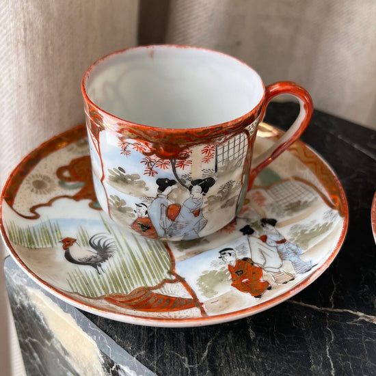 A Pair of Red Japanese Espresso Cups and Saucers