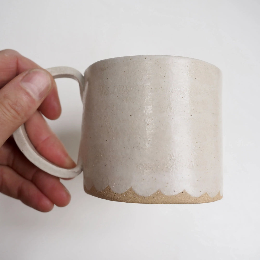 Cream Ceramic Mug with a Scalloped Lower Edge