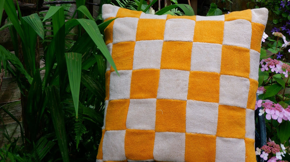 Yellow chequered towelling cushion