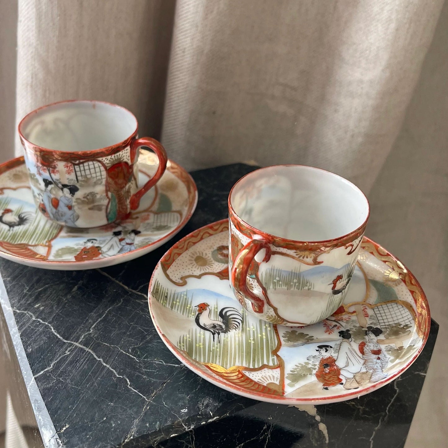 A Pair of Red Japanese Espresso Cups and Saucers