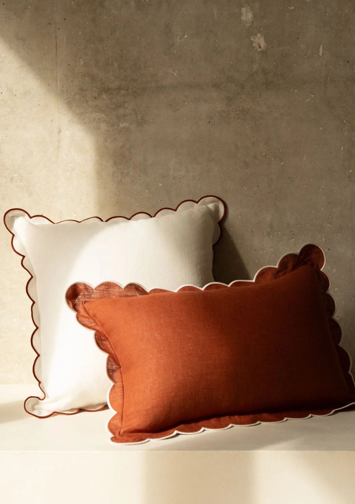 The White & Red Ochre Scalloped Linen Square Cushion